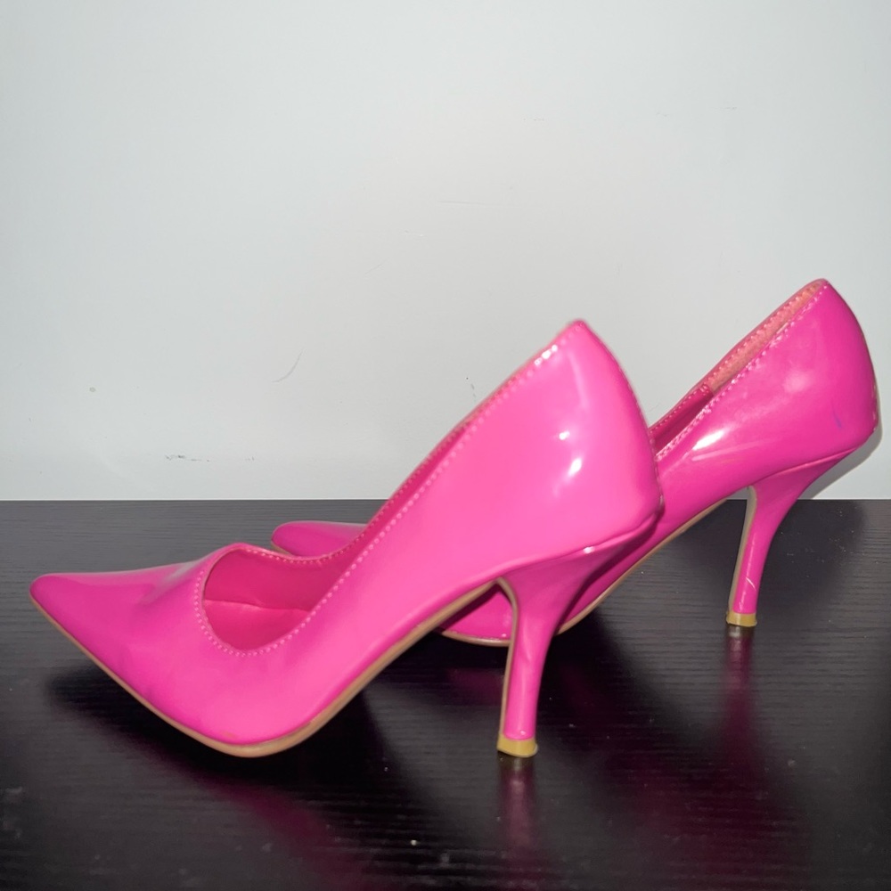 Pink pointed toe high heel pumps